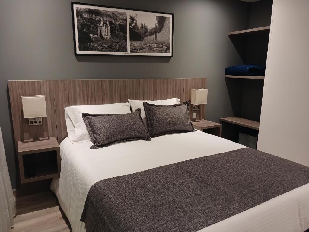 Postel nebo postele na pokoji v ubytování Hotel Santino