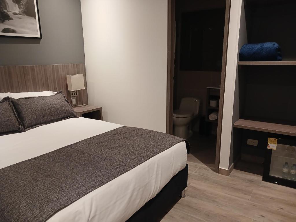Postel nebo postele na pokoji v ubytování Hotel Santino