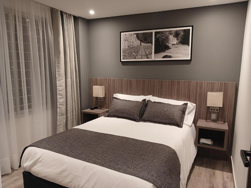 Postel nebo postele na pokoji v ubytování Hotel Santino