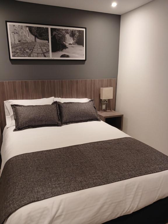 Postel nebo postele na pokoji v ubytování Hotel Santino