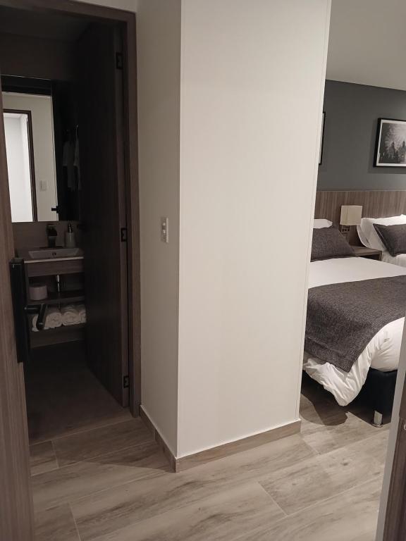 Postel nebo postele na pokoji v ubytování Hotel Santino
