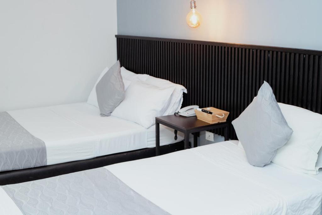 Postel nebo postele na pokoji v ubytování Hotel Palmas del Estadio
