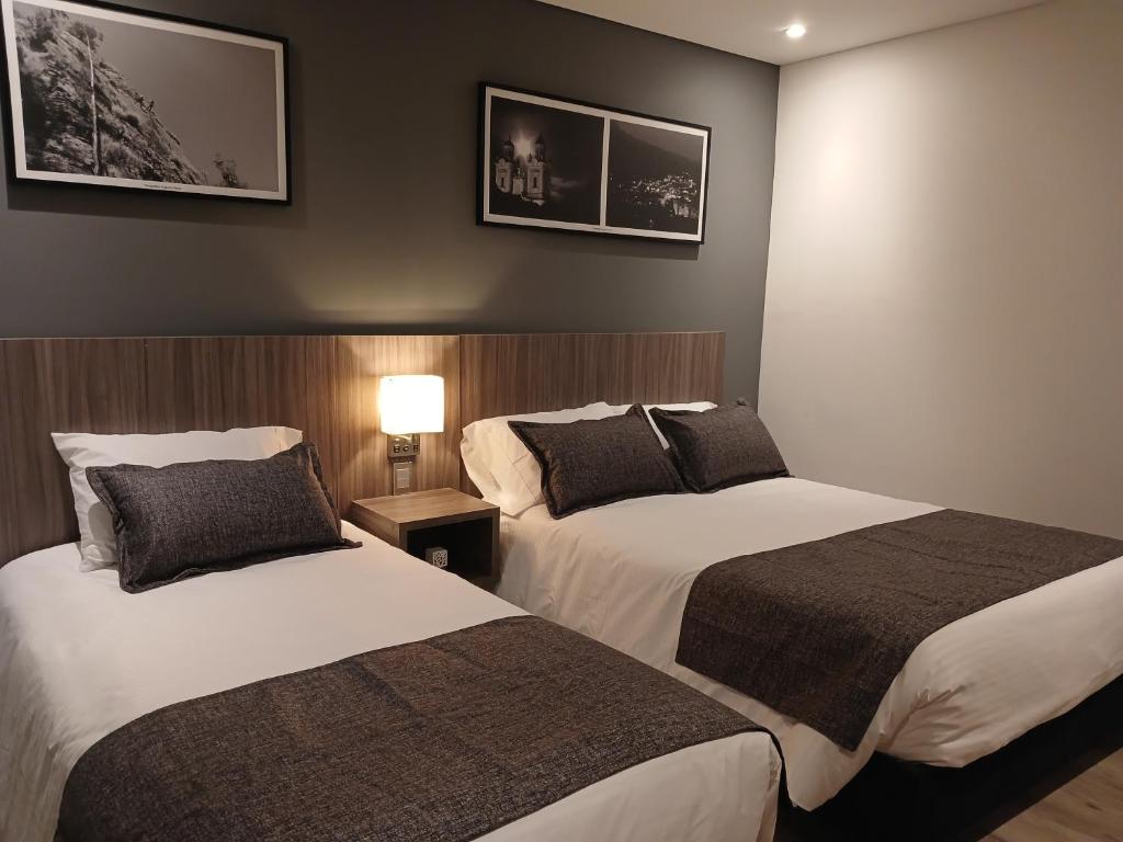 Postel nebo postele na pokoji v ubytování Hotel Santino