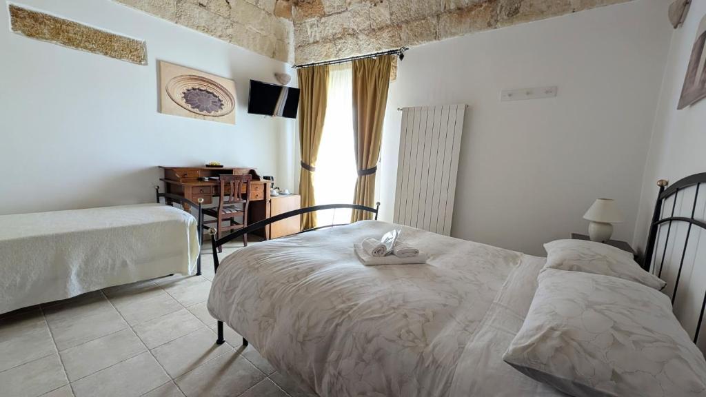 Postel nebo postele na pokoji v ubytování B&B Corte Regina Esther