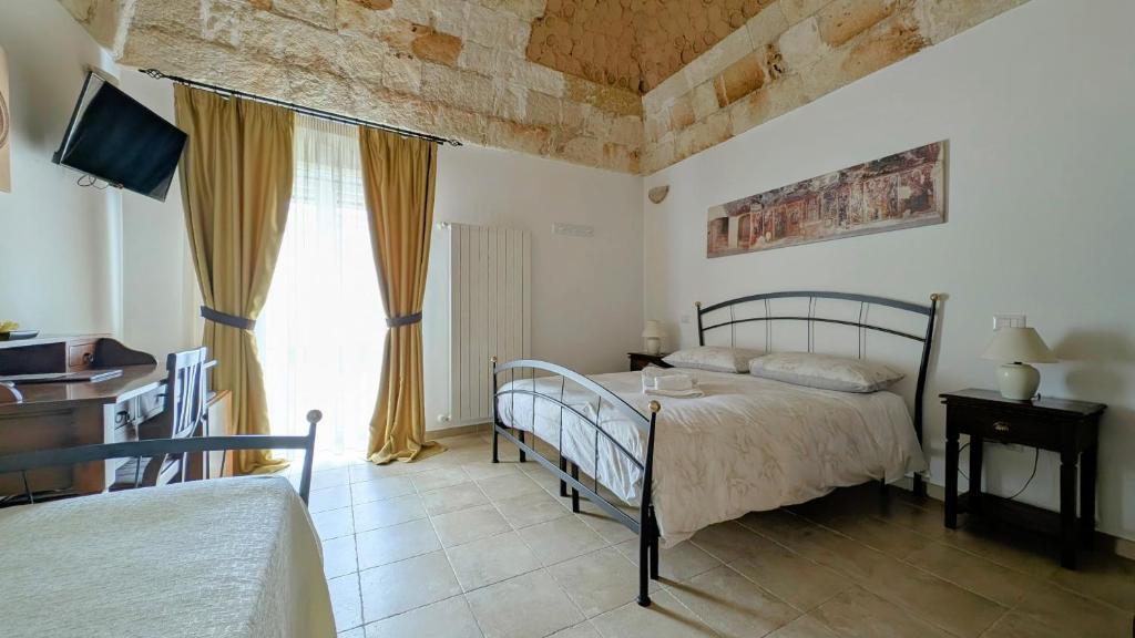 Postel nebo postele na pokoji v ubytování B&B Corte Regina Esther