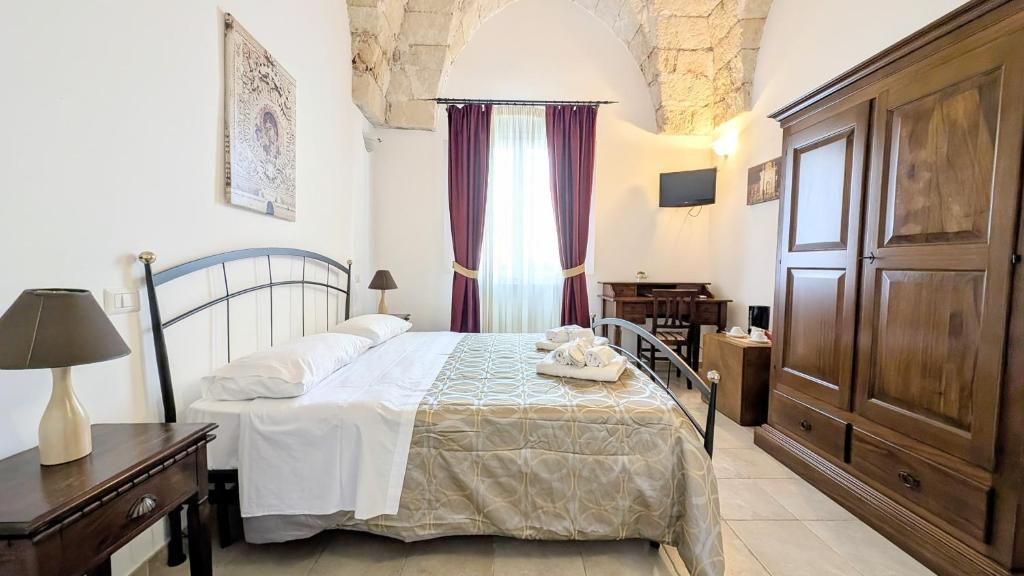 Postel nebo postele na pokoji v ubytování B&B Corte Regina Esther