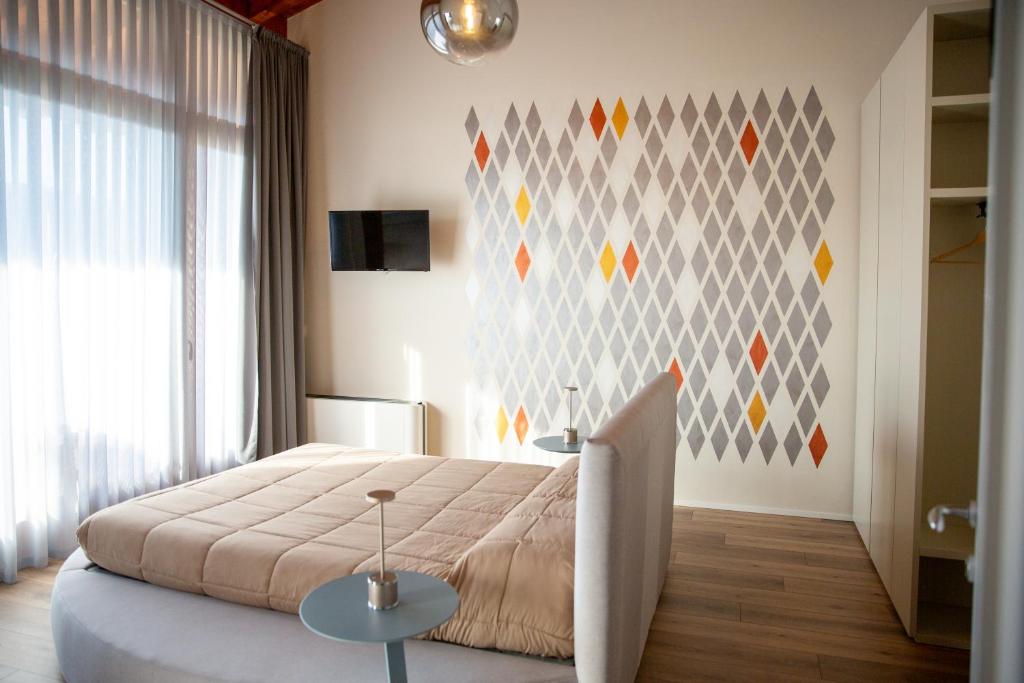 Postel nebo postele na pokoji v ubytování B&B LA VALLUNA