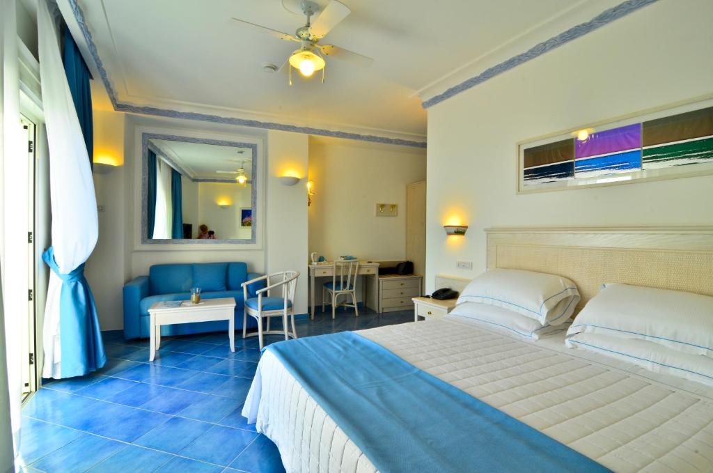 Postel nebo postele na pokoji v ubytování Hotel Aurora