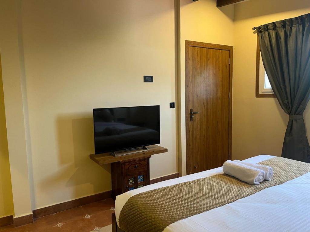 TV a/nebo společenská místnost v ubytování Hotel Lotus