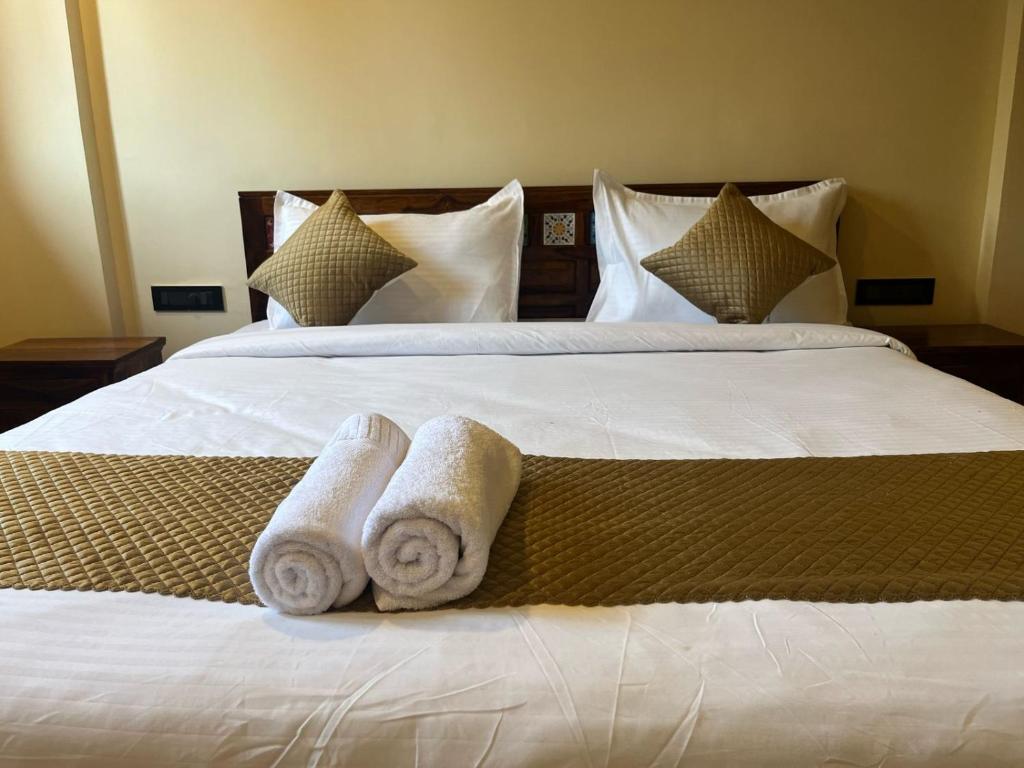 Postel nebo postele na pokoji v ubytování Hotel Lotus