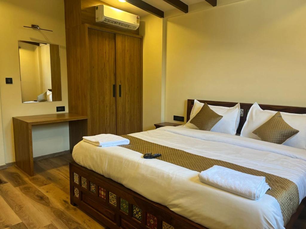 Postel nebo postele na pokoji v ubytování Hotel Lotus