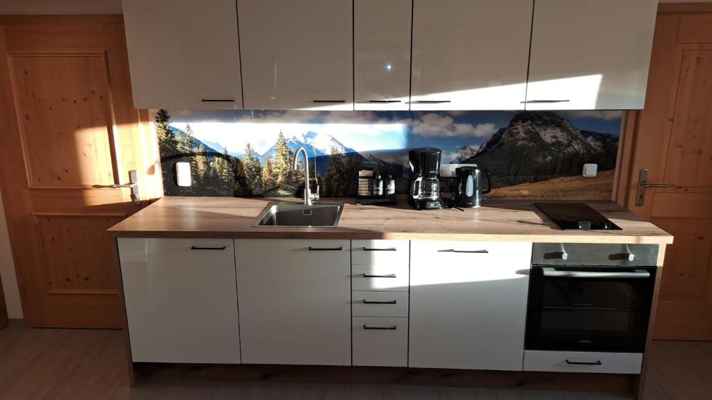 Kuchyň nebo kuchyňský kout v ubytování Ferienwohnung Feichtlgütl