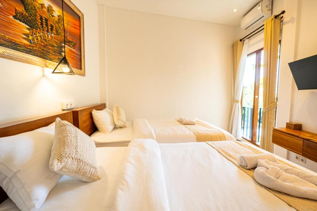 Postel nebo postele na pokoji v ubytování Lemon Tree Hotel Bali