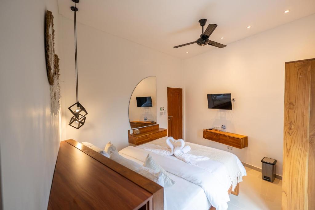 Postel nebo postele na pokoji v ubytování Lemon Tree Hotel Bali