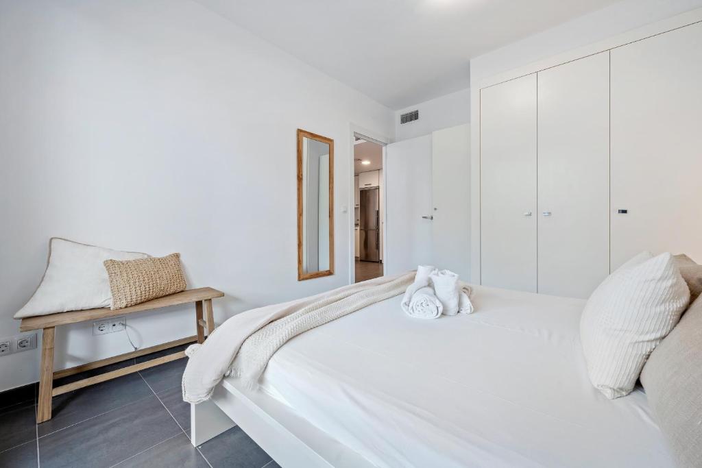 Posteľ alebo postele v izbe v ubytovaní Hauzify I Apartaments Roques Daurades