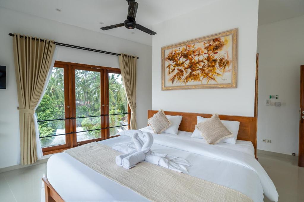 Postel nebo postele na pokoji v ubytování Lemon Tree Hotel Bali