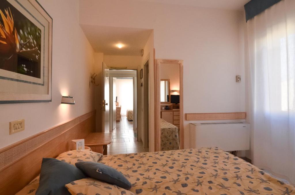 Postel nebo postele na pokoji v ubytování Hotel Aurora