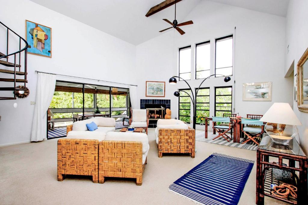 a living room with a couch and a table at A Morning Glory in Sanibel