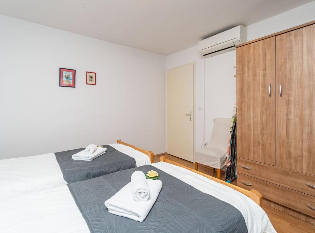 Posteľ alebo postele v izbe v ubytovaní Apartment Lolo