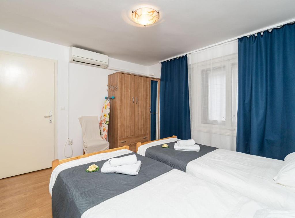 Posteľ alebo postele v izbe v ubytovaní Apartment Lolo