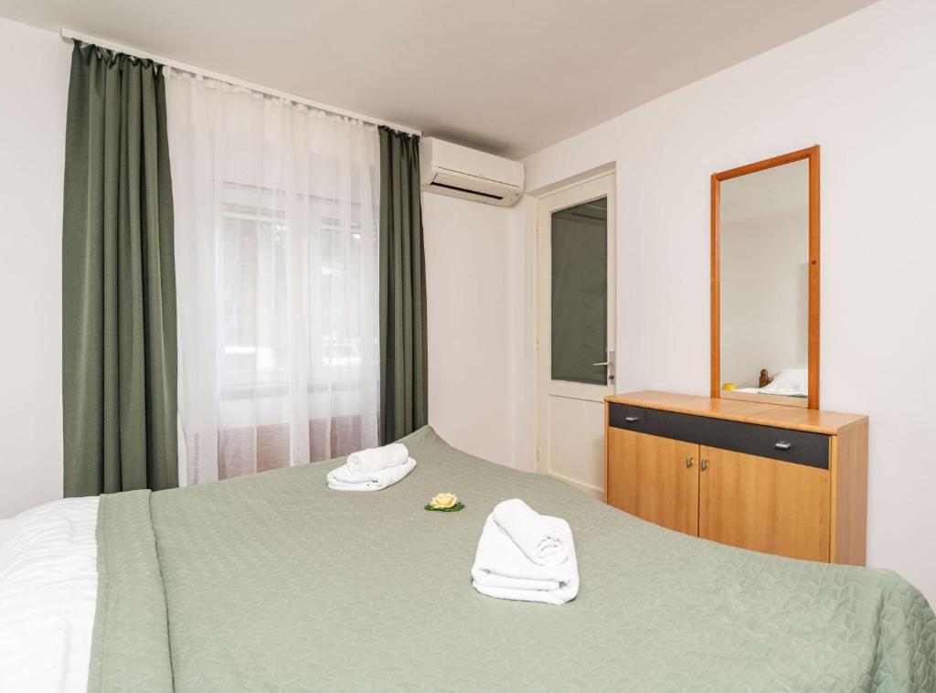 Posteľ alebo postele v izbe v ubytovaní Apartment Lolo