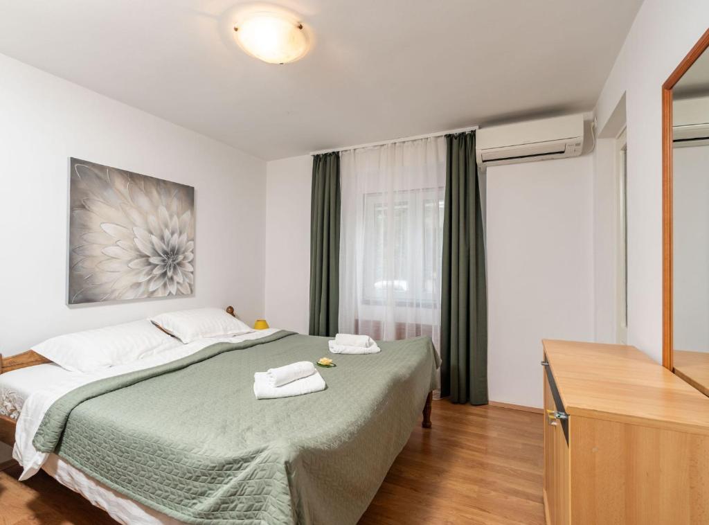 Posteľ alebo postele v izbe v ubytovaní Apartment Lolo