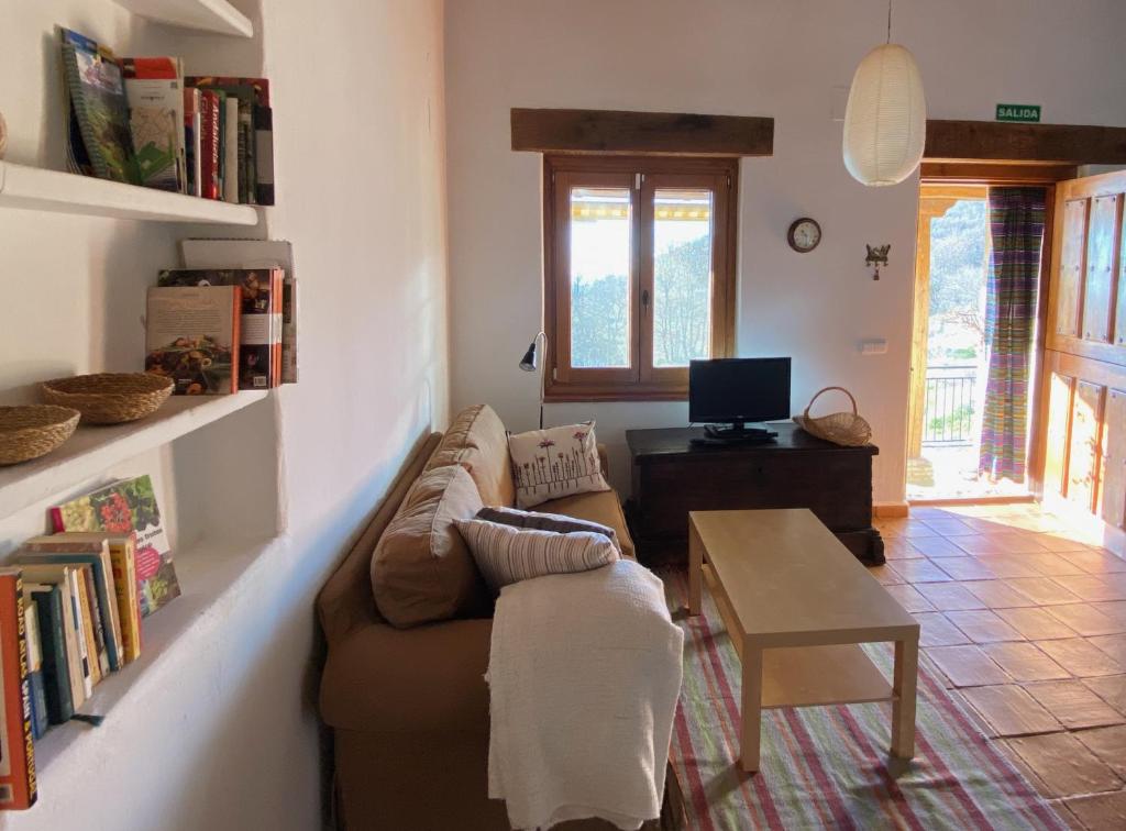 a living room with a couch and a table at Vergel San Pedro in Torremenga
