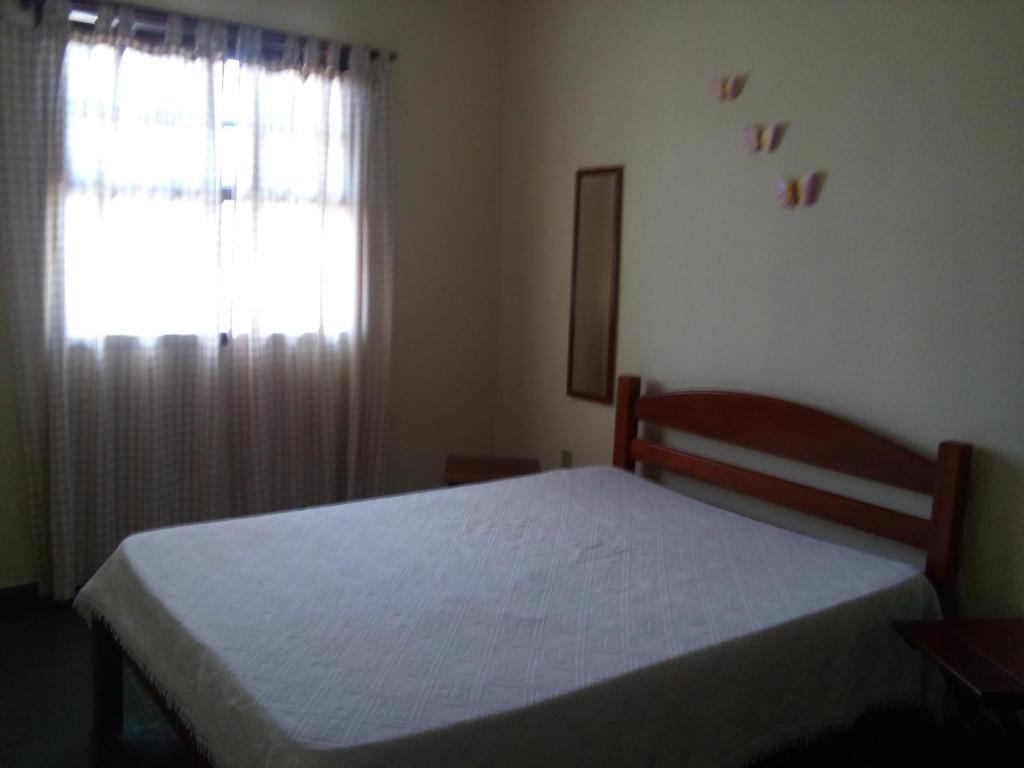 Postel nebo postele na pokoji v ubytování Residencial Doce Marina