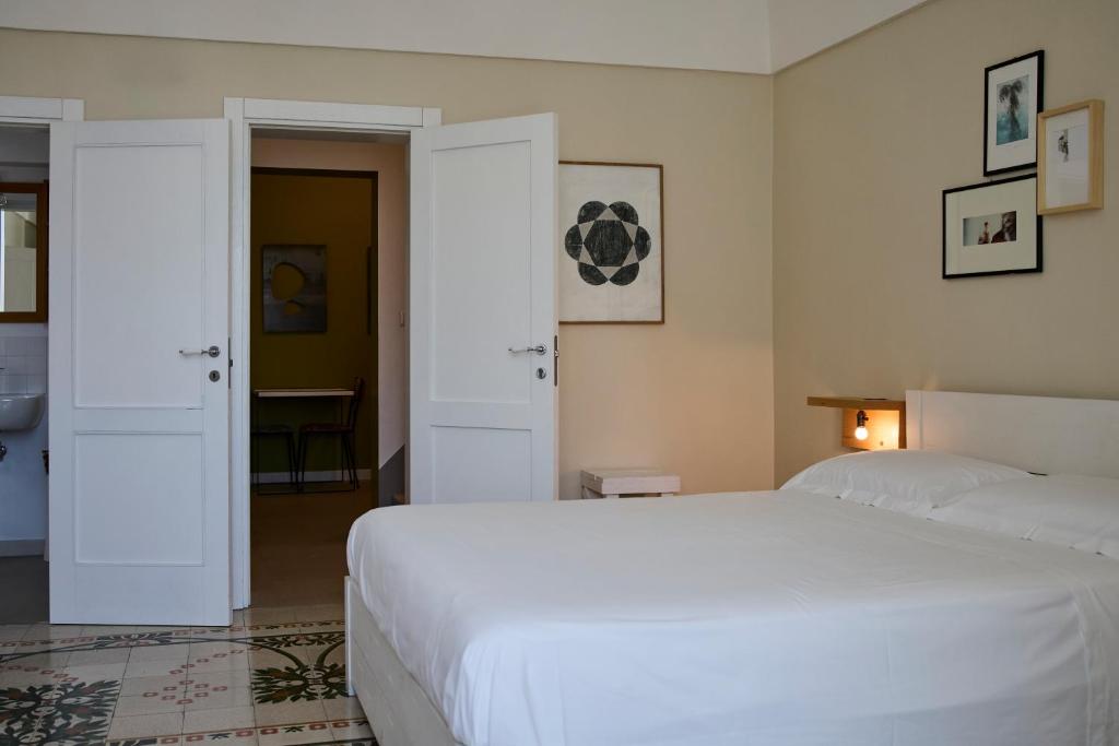 Postel nebo postele na pokoji v ubytování B&B Casa Ninè