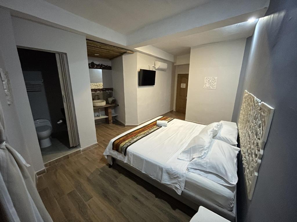 Postel nebo postele na pokoji v ubytování Hotel el Ancla Campestre