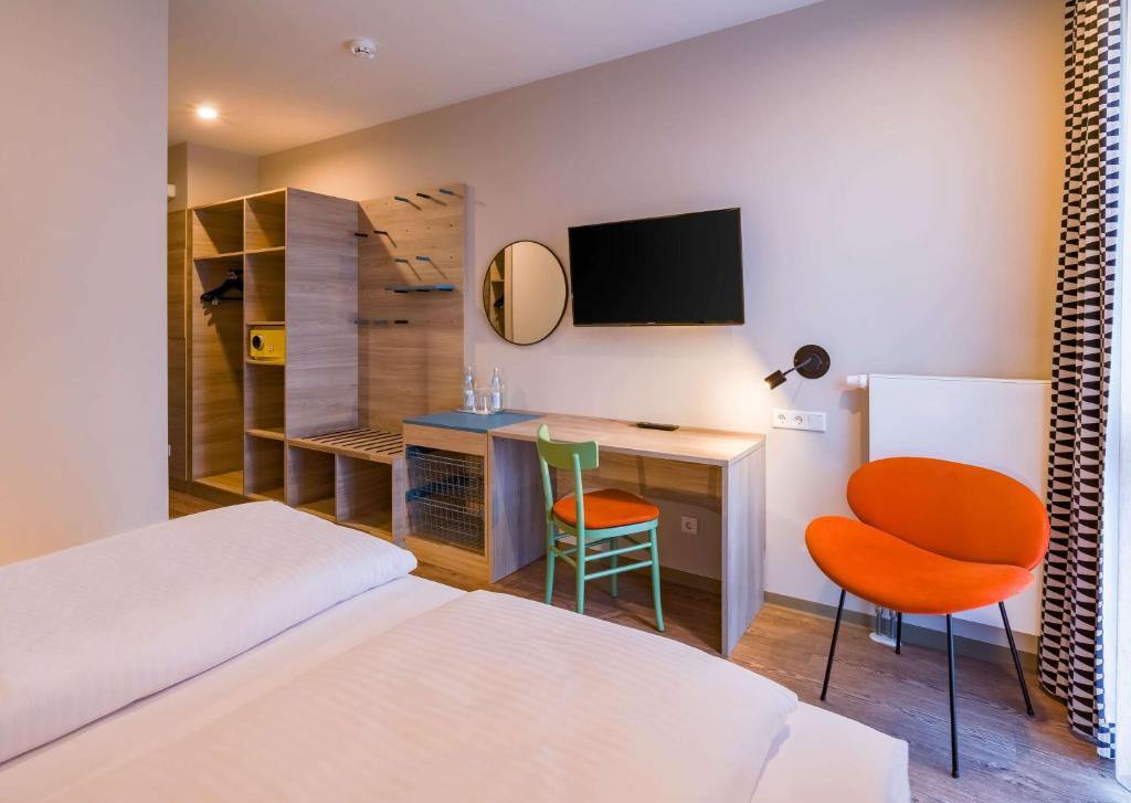 Letto o letti in una camera di Ramada Encore by Wyndham Munich Messe