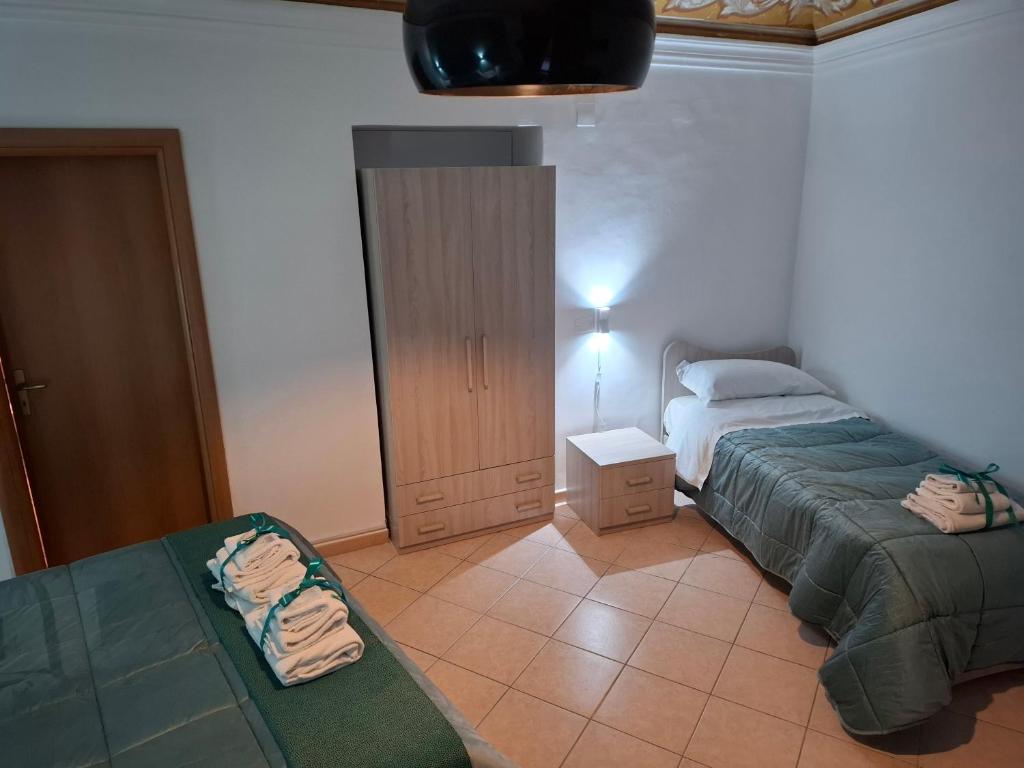 Postel nebo postele na pokoji v ubytování B&B Le Lumìe "Il Cortiletto Del Centro"