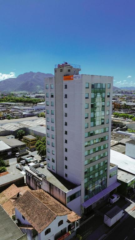 an overhead view of a tall white building in a city at Transamerica Fit Serra in Serra