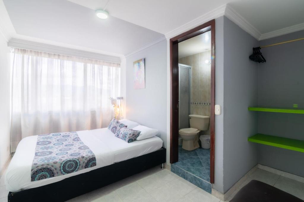 Voodi või voodid majutusasutuse Hotel Elegant Suite toas