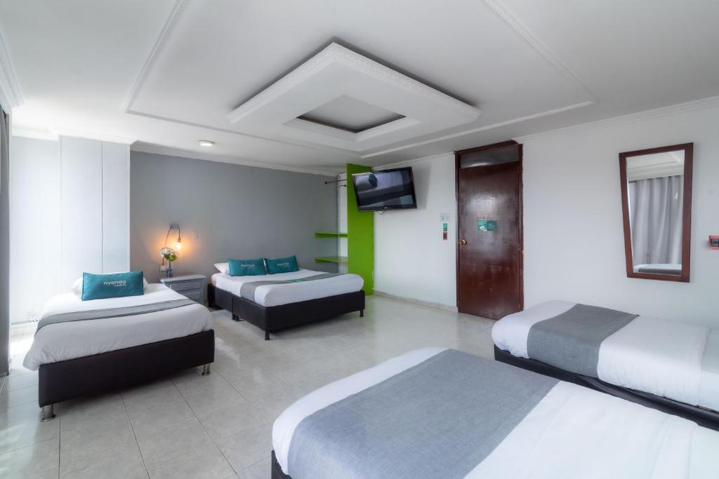 Voodi või voodid majutusasutuse Hotel Elegant Suite toas