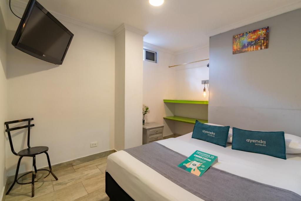 Voodi või voodid majutusasutuse Hotel Elegant Suite toas