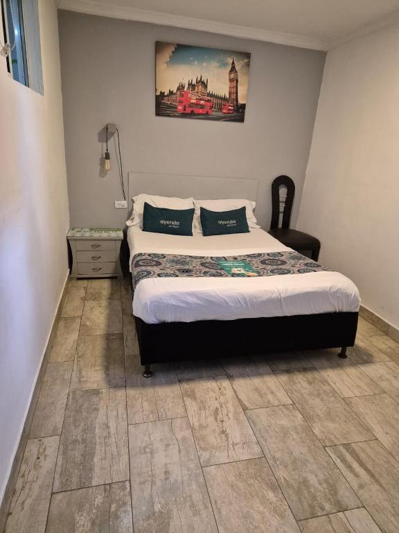 Voodi või voodid majutusasutuse Hotel Elegant Suite toas