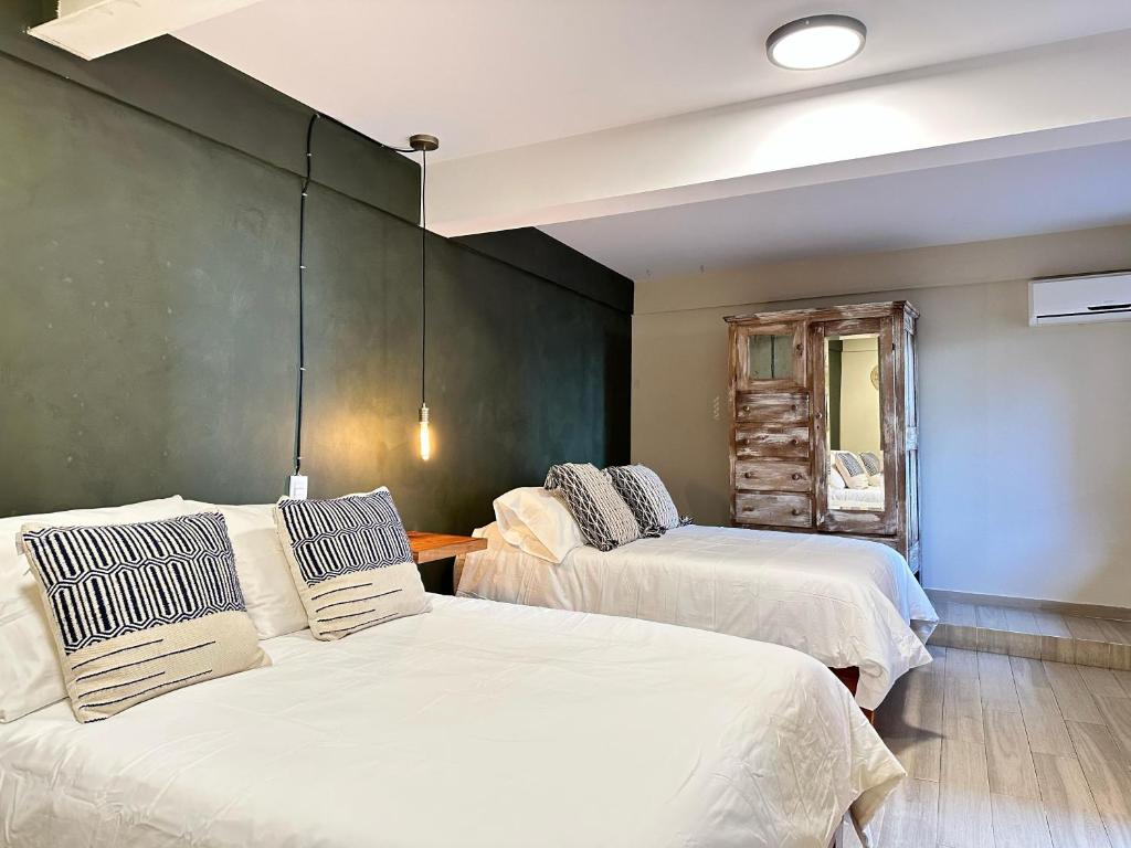 Postel nebo postele na pokoji v ubytování Casa Bakora Hotel