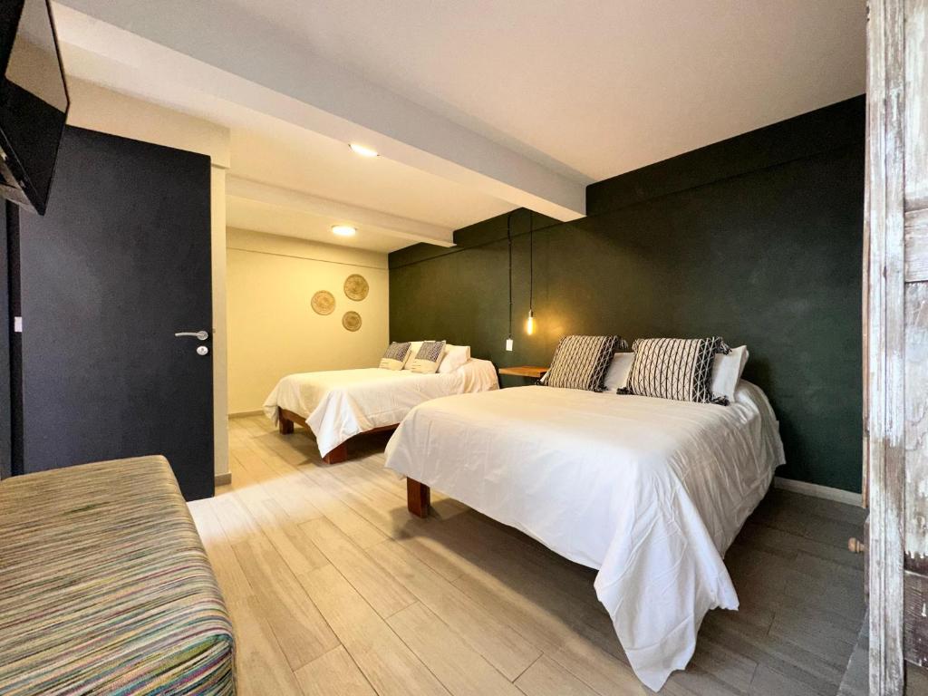 Postel nebo postele na pokoji v ubytování Casa Bakora Hotel