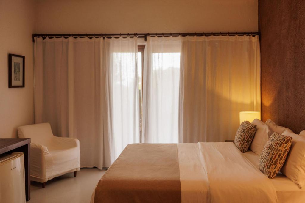 Postel nebo postele na pokoji v ubytování Hotel Maitei