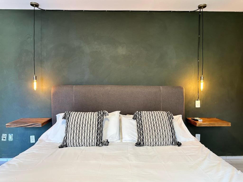 Postel nebo postele na pokoji v ubytování Casa Bakora Hotel