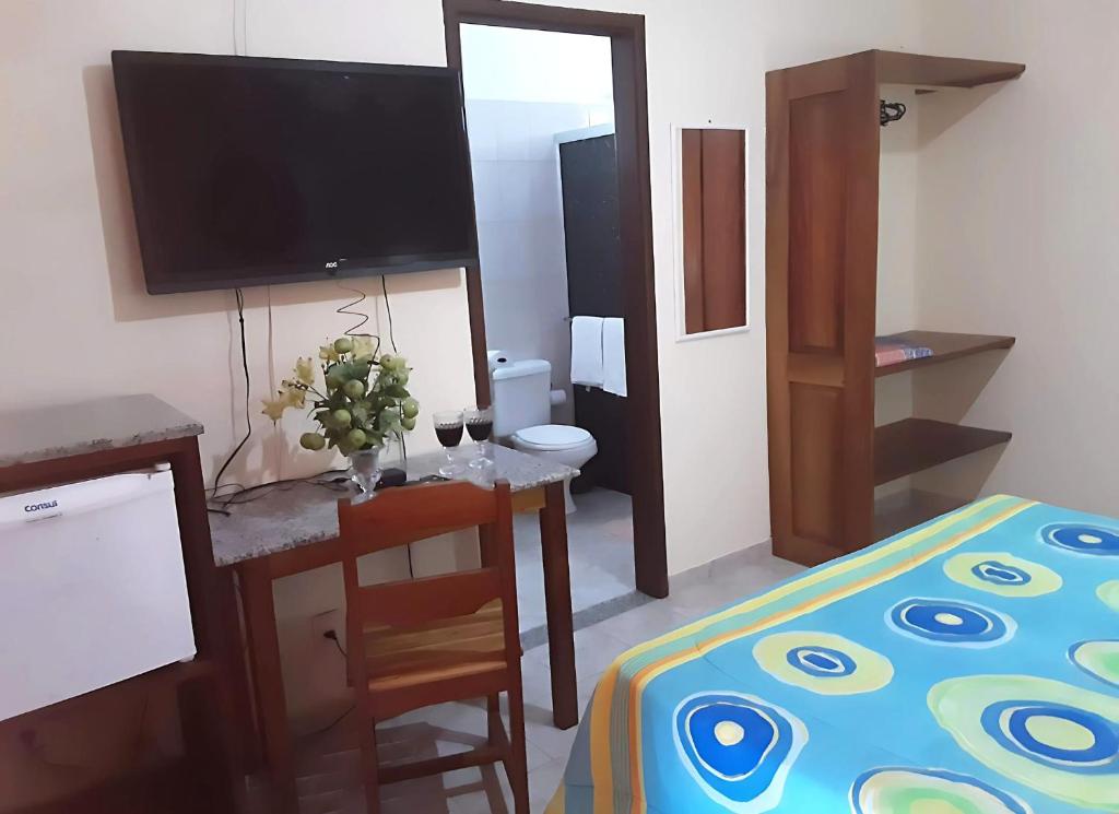 TV a/nebo společenská místnost v ubytování Hotel Patipe Canavieiras