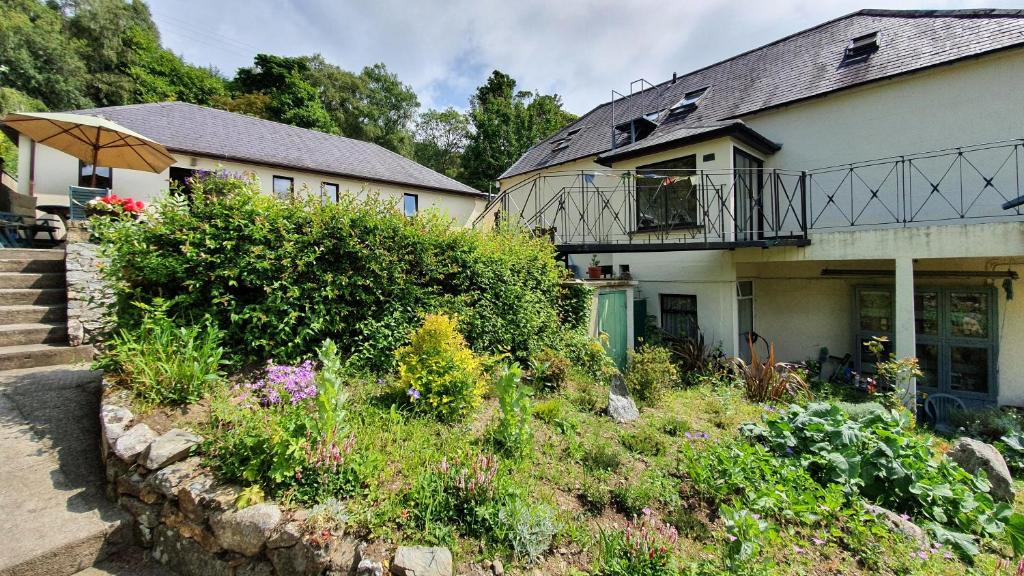 a house with a garden in front of it at Glendalough Sanctuary in Brockagh