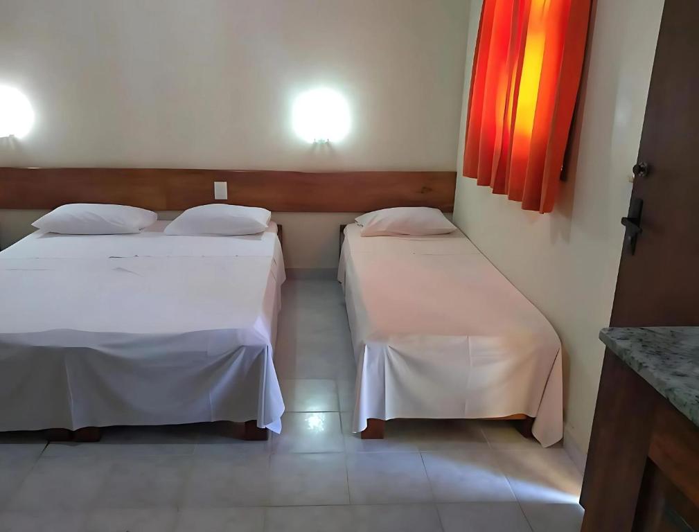 Postel nebo postele na pokoji v ubytování Hotel Patipe Canavieiras