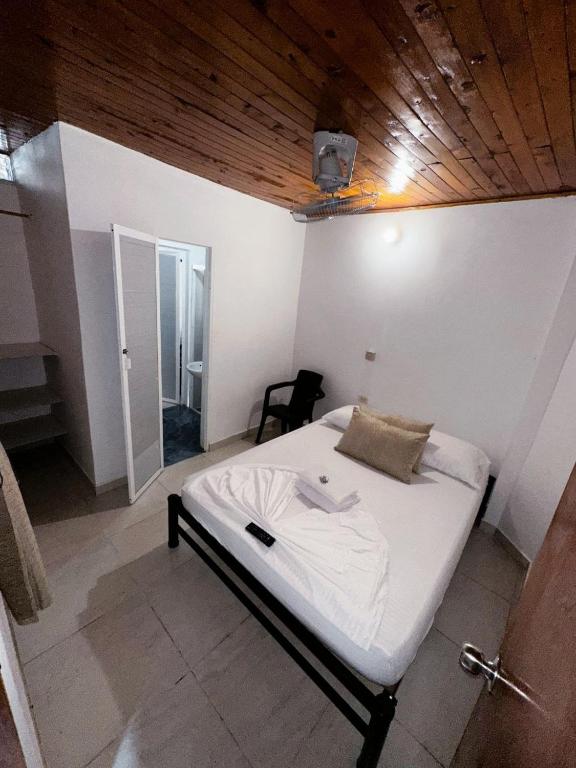 Postel nebo postele na pokoji v ubytování Casa Turistica JM
