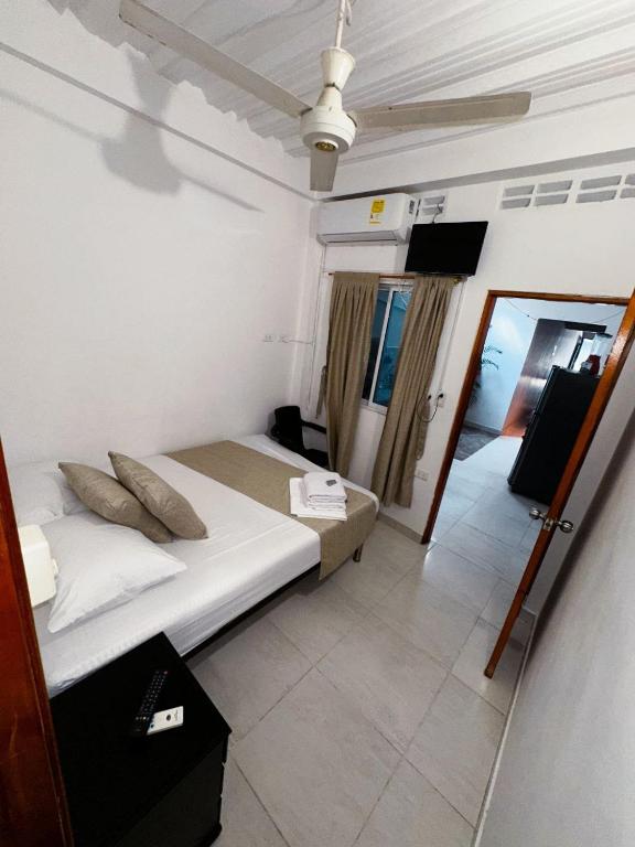 Postel nebo postele na pokoji v ubytování Casa Turistica JM