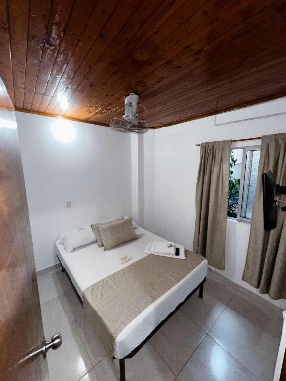 Postel nebo postele na pokoji v ubytování Casa Turistica JM