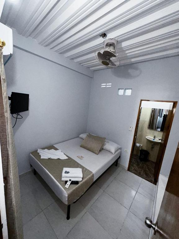 Postel nebo postele na pokoji v ubytování Casa Turistica JM