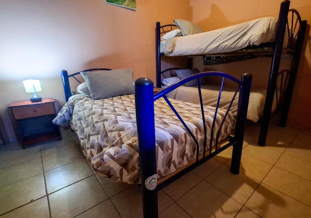 Postel nebo postele na pokoji v ubytování Hostal Hara