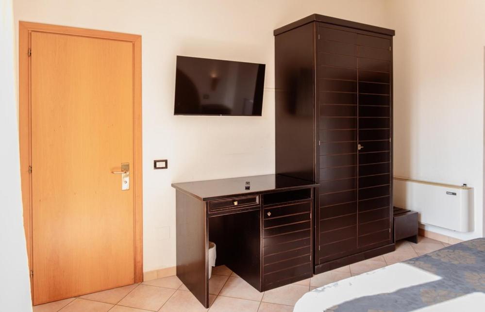 TV a/nebo společenská místnost v ubytování Hotel Rossi
